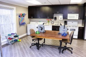 The rehab gym with a table at Louisville East