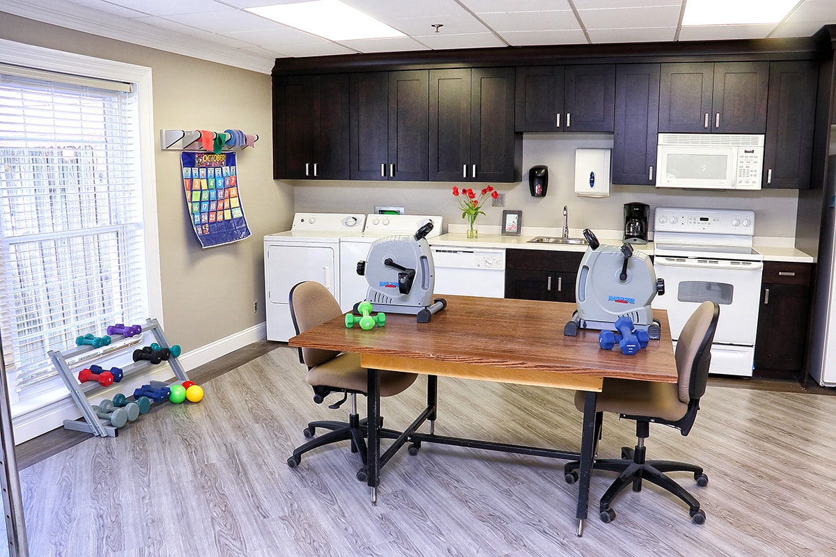 The rehab gym with a table at Louisville East